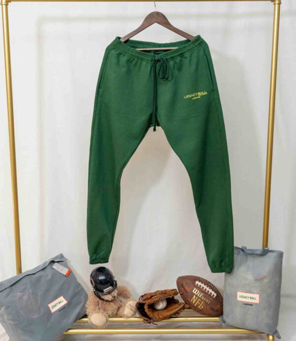 dark green sweater pants hang